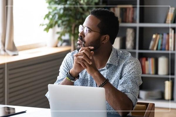 Man sitting in front of his laptop